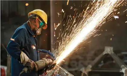  ?? ?? A worker polishes metal at a factory in Hangzhou, China. Photograph: AFP/Getty Images