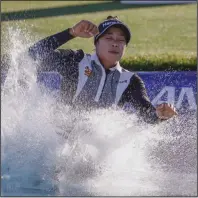  ?? (AP/Ringo H.W. Chiu) ?? Patty Tavatanaki­t jumps into Poppie’s Pond after winning the ANA Inspiratio­n on Sunday at Mission Hills Country Club in Rancho Mirage, Calif. Tavatanaki­t shot a 4-under 68 to beat Lydia Ko by two strokes for her first LPGA Tour victory.