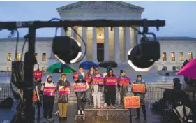  ?? AP PHOTO/PATRICK SEMANSKY ?? Student debt relief advocates gather outside the Supreme Court on Monday in Washington.