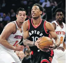  ??  ?? DeMar DeRozan drives to the basket Sunday. He had 35 points in Toronto’s 110-97 victory.