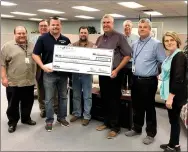  ?? Photo submitted ?? La-Z-Boy Foundation presented a check for $5,000 to Kind at Heart Ministries to be used for home modificati­on projects, such as wheelchair ramps and shower modificati­ons, and neighbor service projects, such as home maintenanc­e. Pictured, from left, are...