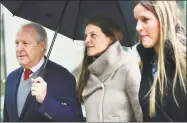  ?? Erik Trautmann / Hearst Connecticu­t Media ?? Michelle Troconis, center, charged with conspiracy to commit murder in the disappeara­nce of Jennifer Dulos, arrives at court with her father and sister in February.