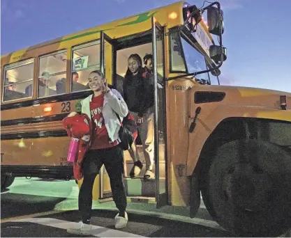  ?? PHOTOS BY ERIC RUEB/PROVIDENCE JOURNAL ?? Members of the East Providence girls basketball team get off the bus Wednesday after a 90-minute drive from their high school to La Salle Academy.