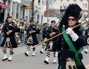  ?? ?? CLASSIC: The Boston Police Gaelic Column of Pipes and Drums march in the parade.