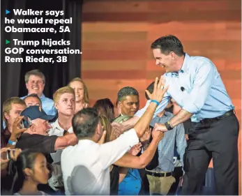  ?? CHRISTOPHE­R DILTS, BLOOMBERG ?? Scott Walker, governor of Wisconsin, greets people during his campaign announceme­nt.