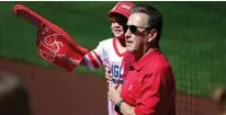  ?? Tribune News Service ?? In this photo from 2021, Los Angeles Angels owner Arte Moreno poses for a picture with a young fan prior to the MLB spring training baseball game between the Los Angeles Angels and Milwaukee Brewers.