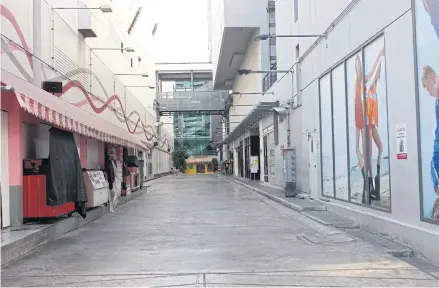  ?? NUTTHAWAT WICHEANBUT ?? This April 23 photo shows an empty Siam Square with the pandemic having shut down the economy.