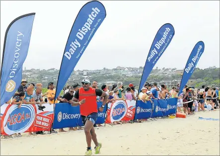  ?? Picture: SINO MAJANGAZA ?? FINAL STRAIGHT: A runner rushes to the finish line in the 17.5km Discovery Surfers Challenge from Kwelera to Nahoon Beach on Saturday