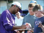  ?? RANDY MEYERS — FOR THE MORNING JOURNAL ?? Coco Crisp signs autographs prior to the game against River City on Aug. 3 at Sprenger Stadium.