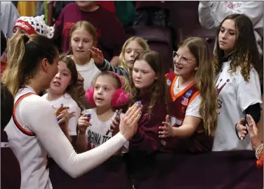  ?? ?? Future Hokies: Virginia Tech's Elizabeth Kitley (33) meets with fans after a game against North Carolina in Blacksburg Va. Sunday. Kitley scored 34 points in a 74-62 victory.