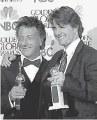  ??  ?? Tom Cruise, right, with Dustin Hoffman in 1997. USA TODAY FILE PHOTO