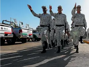  ?? AP ?? National Guard troops arrive at a border crossing in Ciudad Hidalgo, Mexico, as more security forces are deployed along the southern border with Guatemala.