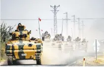 ??  ?? THIS PICTURE taken around 5 kilometers west from the Turkish Syrian border city of Karkamis in the southern region of Gaziantep on Aug. 25 shows Turkish Army tanks driving to the Syrian Turkish border town of Jarabulus.