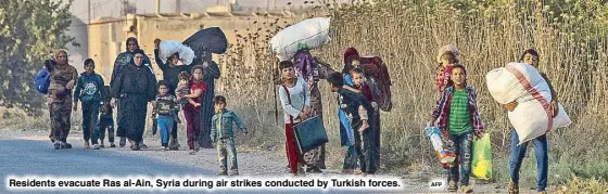  ?? AFP ?? Residents evacuate Ras al-Ain, Syria during air strikes conducted by Turkish forces.