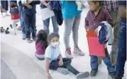  ?? — Reuters file photo ?? Undocument­ed immigrant families are released from detention at a bus depot in Mcallen, Texas.