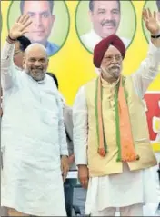  ?? SAMEER SEHGAL/HT ?? BJP president Amit Shah with party candidate Hardeep Singh Puri at a rally in Amritsar on Sunday.