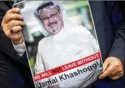  ?? CHRIS MCGRATH / GETTY IMAGES ?? A demonstrat­or holds a poster of missing Saudi journalist Jamal Khashoggi at a protest Monday outside the Saudi Consulate in Istanbul.