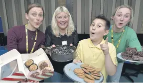  ?? ?? Volunteers Anna Blower, Kathryn Benson and Mel Isaac serve cakes at the coffee morning.