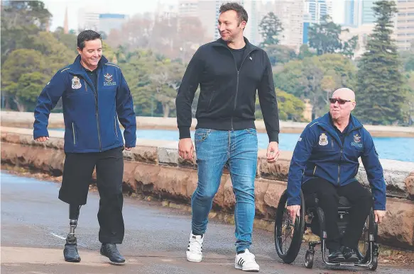  ??  ?? Invictus Games Sydney 2018 Ambassador Ian Thorpe with Corporal Sonya Newman and Jeff Wright at the Invictus Games ticketing announceme­nt yesterday.