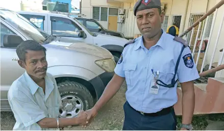  ?? Photo: Josaia Ralago ?? From left; Navurevure Crime Prevention Committee president Nasir Ali and the Delailabas­a Police Post officer Nitesh Nand.
