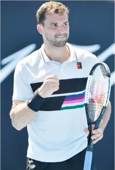  ?? — AFP photo ?? Dimitrov reacts after a point against Janko Tipsarevic during their men’s singles match on day one of the Australian Open tennis tournament in Melbourne.