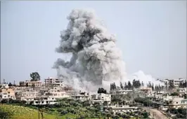  ?? MOHAMAD ABAZEED/GETTY-AFP ?? A rebel-held area in the Syrian city of Daraa was reportedly hit by an airstrike Saturday.