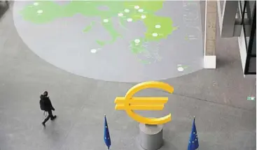  ?? — Bloomberg ?? Differing opinions: a euro symbol at the ECB headquarte­rs in Frankfurt, Germany. The European central bank has been an avid supporter of more stringent climate requiremen­ts while US regulators have been more cautious in their approach.