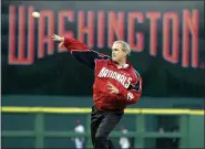  ?? EVAN VUCCI - ASSOCIATED PRESS ?? In this April 14, 2005, file photo, President George W. Bush throws out the ceremonial first pitch at the Washington Nationals home opener in Washington.