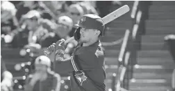  ?? FRANK FRANKLIN II/AP ?? Blue Jays infielder Cavan Biggio follows through on a single during a spring training game Saturday against the Yankees.