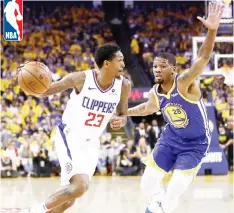  ??  ?? Lou Williams (left) of the LA Clippers drives on Alfonzo McKinnie of the Golden State Warriors during Game Five of the first round of the NBA Western Conference Playoffs at ORACLE Arena in Oakland, California. — AFP photo