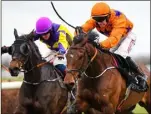  ??  ?? My Newbrook Rose, with Jonathan Moore up, on their way to winning The BetVictor Handicap Hurdle from eventual second place Fourina, with Ricky Doyle up, after jumping the last at Thurles.