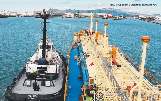  ?? DEAL: A tug guides a vessel into Townsville Port. ??