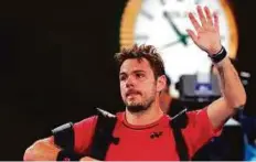  ?? AP ?? Switzerlan­d’s Stan Wawrinka waves as he leaves the Rod Laver Arena after his semi-final loss to Roger Federer.