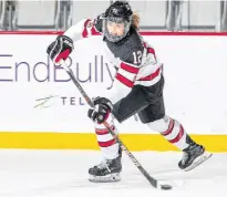  ?? HOCKEY CANADA IMAGES ?? Allie Munroe, a defenceman from Yarmouth, N.S., feeds a pass during a Team Canada women's developmen­t team game against the United States at Hockey Canada's Summer Showcase in 2018 in Calgary. Munroe is attending the national team's selection camp in Halifax this week.