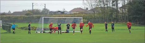  ?? Photo Kirsty Stewart. ?? Arran players turn to celebrate as Grant Adamson scores his first goal.