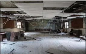  ?? (Arkansas Democrat-Gazette/Cary Jenkins) ?? Remains of a dropped ceiling that had been added in its later years are evident in the Mt. Olive Rosenwald School in Bradley County.