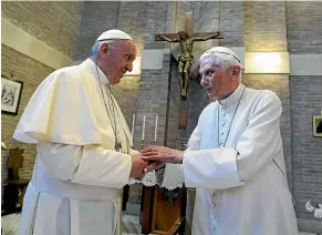  ?? AP ?? Pope Francis, left, and Pope Benedict XVI are pictured together in 2017.
