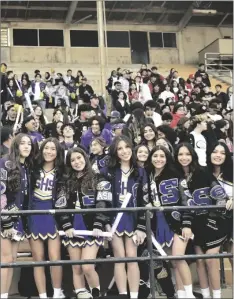  ?? ODETT OCHOA PHOTO ?? Members of the Southwest High School cheer squad and other Southwest students smile for the camera at the Grandstand­s of the California Mid-Winter Fair for High School Madness, Monday, March 6, in Imperial.