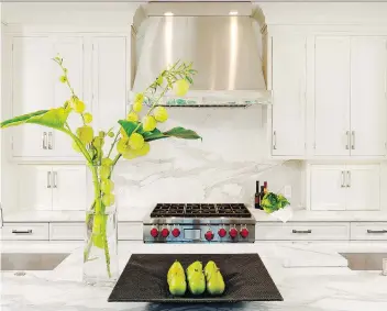  ?? BOB NAROD. ?? This Jennifer Gilmer kitchen features counters made of honed marble, a material some designers will steer clients away from given its relative fragility when compared to man-made materials.