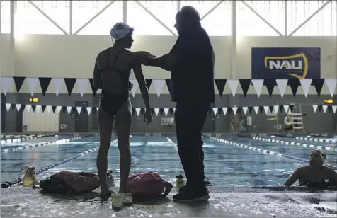  ?? COACH RICK SHIPHERD, Photograph­s by Christina House Los Angeles Times ?? right, with Clemence Choy, left, tells swimmers “don’t be frail” and also encourages them to support one another.