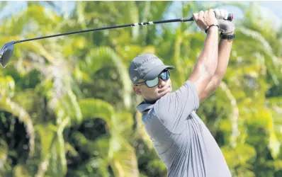  ?? PHOTOGRAPH BY LAAC ?? William Knibbs of Jamaica plays a stroke from the No. 13 tee during Round One of the 2023 Latin America Amateur Championsh­ip at the Grand Reserve Golf Club in Puerto Rico on Thursday, January 12, 2023.