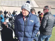  ?? AP PHOTO ?? CHILLY WILLY: Pats coach Bill Belichick is bundled up as he finishes his meeting with the media yesterday.