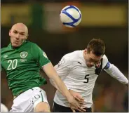  ??  ?? Conor Sammon - who was on the losing side in New Ross 15 years ago - winning one of his nine full internatio­nal caps in this clash with Christian Fuchs of Austria in 2013.