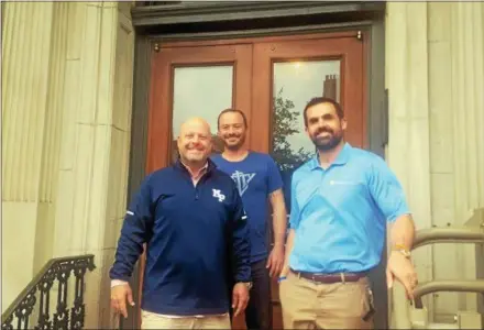  ?? SUBMITTED PHOTO ?? F & M Building owner Tom Myles, left, Seth Gentile, project manager, and Tommy Ciccarone, leasing agent, celebrate full leasing capacity at the F & M Building in West Chester.