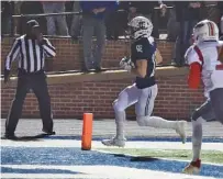  ?? STAFF PHOTO BY MATT HAMILTON ?? Gordon Lee running back Cade Peterson trots into the end zone for a touchdown during Friday’s GHSA Class A public playoff win against Georgia Military College Prep in Chickamaug­a, Ga. The host Trojans won 56-0 in their first home playoff game in 13 years, advancing to a second-round game next week at Commerce.