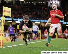  ?? ?? Beauden Barrett dives over.