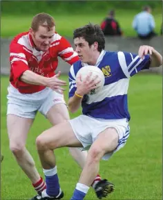  ??  ?? David McComish, Gaels, beats Michael Daly of Malachy’s to this ball in the Grogan Cup final held at Roche.