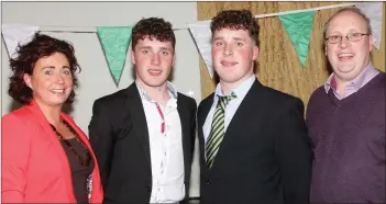  ??  ?? The O’Keeffe twins, David and Stephen, at the St. Peter’s College Senior football medals presentati­on with their proud parents, Sarah and Michael.