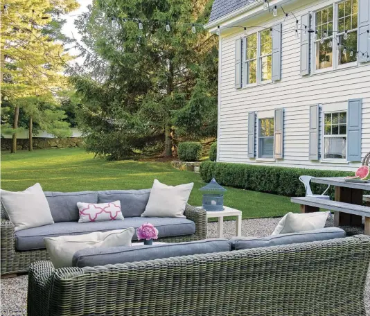  ??  ?? OUTDOOR LIFE. In addition to the front and back yard landscapin­g, Eileen also worked with Robin Kramer of Robin Kramer Garden Design to create spaces for conversati­ons, meals and entertaini­ng. In the backyard, sofas from Restoratio­n Hardware are as...