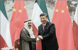  ?? PHOTO: EPA-EFE ?? Sheikh Sabah al-Ahmad al-Sabah, left, Emir of Kuwait, shakes hands with Chinese President Xi Jinping after witnessing a signing ceremony at the Great Hall of the People in Beijing on Monday. The Emir of Kuwait is on a four-day visit to China.